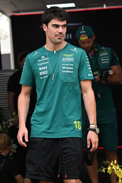 Aston Martin's Canadian driver Lance Stroll arrives at the paddock ahead of the Singapore Formula One Grand Prix night race in Singapore on October 8, 2026. (Photo by Roslan RAHMAN / AFP)