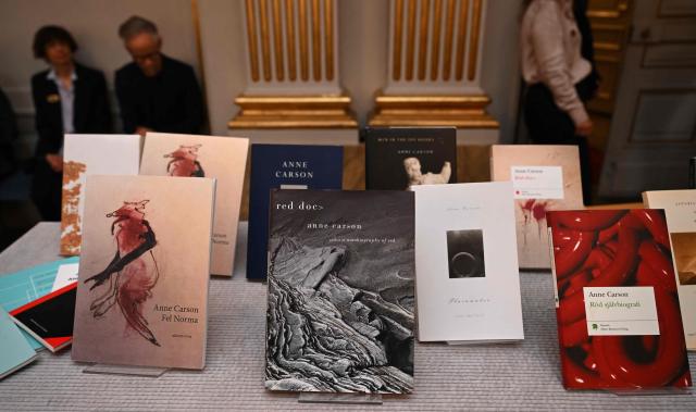 Copies of books by Canadian author Anne Carson are on display at the Swedish Academy in Stockholm, Sweden, after a press conference on October 8, 2026 to announce her as the winner of the 2026 Nobel Prize in Literature. The Nobel Prize in Literature was awarded to Canadian poet Anne Carson, an essayist and classicist who brings a modern twist to mysticism and antiquity in her writings about love, desire and despair. The 76-year-old was honoured "for her bold and inventive oeuvre that, in playful dialogue with the classical tradition, has created new forms for contemporary literature," the Swedish Academy said. (Photo by Jonathan Nackstrand / AFP)