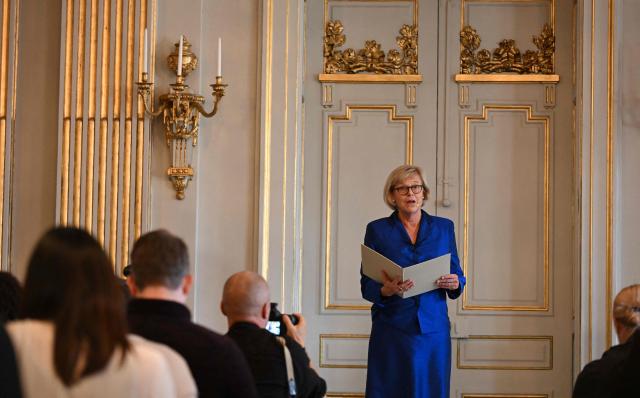 The Permanent Secretary of the Swedish Academy Ingrid Carlberg gives a press conference to announce the winner of the 2026 Nobel Prize in Literature at the Swedish Academy in Stockholm, Sweden, on October 8, 2026. The Nobel Prize in Literature was awarded to Canadian poet Anne Carson, an essayist and classicist who brings a modern twist to mysticism and antiquity in her writings about love, desire and despair. The 76-year-old was honoured "for her bold and inventive oeuvre that, in playful dialogue with the classical tradition, has created new forms for contemporary literature," the Swedish Academy said. (Photo by Jonathan Nackstrand / AFP)