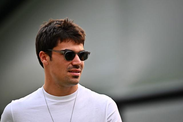 Aston Martin’s Canadian driver Lance Stroll walks in the paddock before the Formula One Singapore Grand Prix night race in Singapore on October 8, 2026. (Photo by Lillian SUWANRUMPHA / AFP)