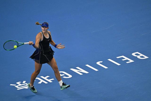 Russia’s Mirra Andreeva hits a return to Russia’s Ekaterina Alexandrova during their women’s singles quarter-final at the China Open tennis tournament in Beijing on October 8, 2026. (Photo by Pedro Pardo / AFP)