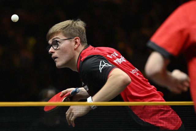 France’s Alexis Lebrun serves to South Korea’s Jang Woo-jin during their men’s singles match at the WTT China Smash table tennis tournament in Beijing on October 8, 2026. (Photo by ADEK BERRY / AFP)