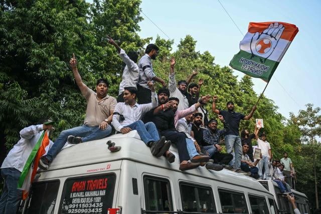 Congress party supporters shout slogans as India's opposition alliance, the INDIA bloc (Indian National Developmental Inclusive Alliance), leaders protest in New Delhi on October 8, 2026 against the country's Chief Election Commissioner Gyanesh Kumar calling for his resignation over alleged irregularities in the Special Intensive Revision (SIR) of electoral rolls. (Photo by Arun SANKAR / AFP)