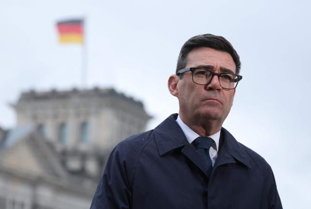 British Prime Minister Andy Burnham gives an tv interview backdropped by the Reichstag building that hosts the German parliament, the Bundestag, following his meeting with the German Chancellor in Berlin on October 8, 2026 . (Photo by Sean GALLUP / POOL / AFP)