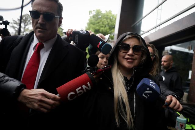 Veronica Ojeda (R), former partner of late Argentine football legend Diego Maradona and mother of his youngest son, Diego Fernando Maradona, arrives with her lawyer Mario Baudry at the court before a hearing in the trial over Maradona's death in San Isidro, Buenos Aires province, Argentina, on October 8, 2026. (Photo by AFP)