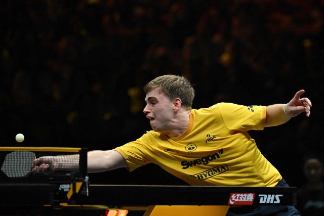 Sweden's Truls Moregard hits a return to China's Wen Ruibo during their men's singles match at the WTT China Smash table tennis tournament in Beijing on October 8, 2026. (Photo by Adek BERRY / AFP)