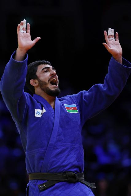 Azerbaijan's Murad Fatiyev reacts after winning the men's under 90 kg bronze medal bout at the World Judo Championships in Baku on October 8, 2026. (Photo by Anne-Christine POUJOULAT / AFP)