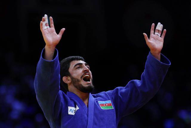 Azerbaijan's Murad Fatiyev reacts after winning the men's under 90 kg bronze medal bout at the World Judo Championships in Baku on October 8, 2026. (Photo by Anne-Christine POUJOULAT / AFP)