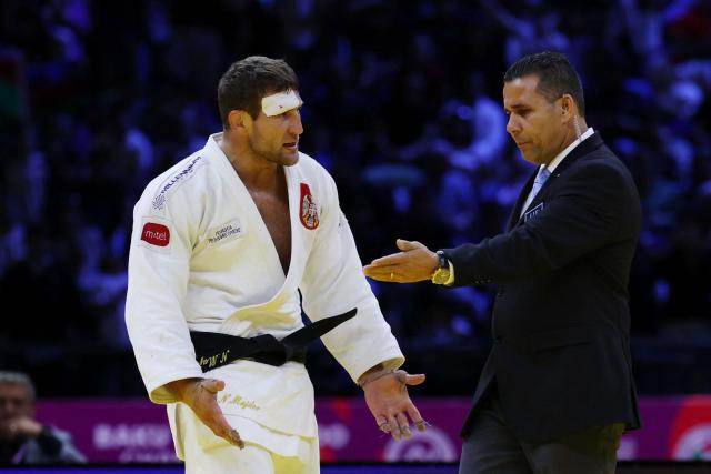 Serbia's Nemanja Majdov reacts during the men's under 90 kg bronze medal bout at the World Judo Championships in Baku on October 8, 2026. (Photo by Anne-Christine POUJOULAT / AFP)