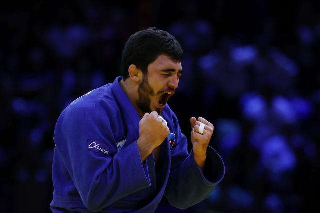 Azerbaijan's Murad Fatiyev reacts after winning the men's under 90 kg bronze medal bout at the World Judo Championships in Baku on October 8, 2026. (Photo by Anne-Christine POUJOULAT / AFP)
