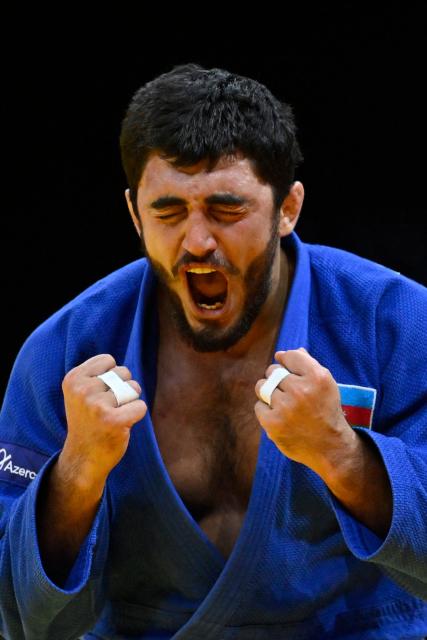 Azerbaijan's Murad Fatiyev reacts after winning the men's under 90 kg bronze medal bout at the World Judo Championships in Baku on October 8, 2026. (Photo by Alexander NEMENOV / AFP)