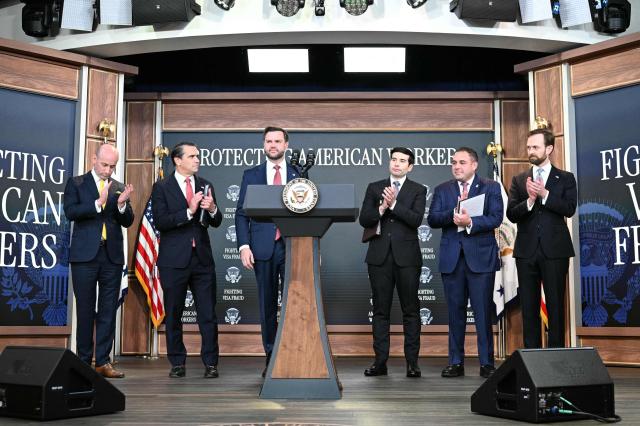 US Vice President JD Vance (C) arrives alongside (L-R) White House Deputy Chief of Staff and Homeland Security Advisor Stephen Miller, US Attorney General Todd Blanche, US Labor Secretary Keith Sonderling, Inspector General of the US Department of Labor Anthony D'Esposito and Federal Trade Commission (FTC) Chair Andrew Ferguson during a press conference to provide an update in the federal investigation and crackdown regarding fraud and abuse of the H-1B visa program in Washington, DC, on October 8, 2026. (Photo by Alex WROBLEWSKI / AFP)