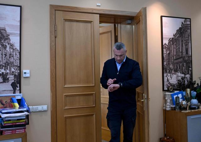 Kyiv's mayor Vitali Klitschko enters his office prior an interview with AFP in Kyiv on October 8, 2026, amid Russian invasion in Ukraine. The wave of Russian strikes that have pummelled the Ukrainian capital, hitting bridges and key infrastructure in recent weeks have pushed Kyiv into survival mode ahead of the winter, the city's mayor told AFP on October 8, 2026. In a tactical shift, Russia has expanded its strikes against Kyiv, targeting key bridges and the city centre in daytime drone attacks. (Photo by Sergei SUPINSKY / AFP)