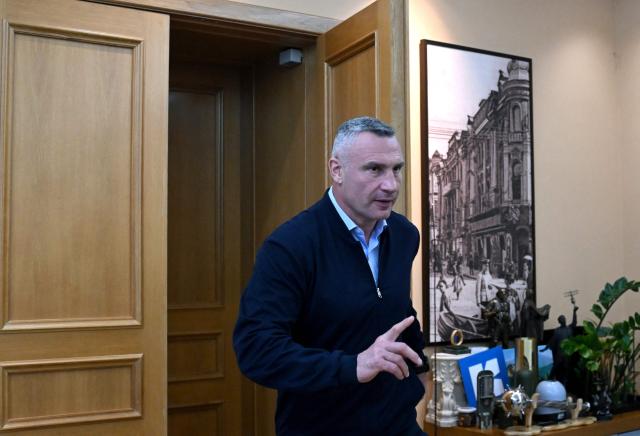Kyiv's mayor Vitali Klitschko enters his office prior an interview with AFP in Kyiv on October 8, 2026, amid Russian invasion in Ukraine. The wave of Russian strikes that have pummelled the Ukrainian capital, hitting bridges and key infrastructure in recent weeks have pushed Kyiv into survival mode ahead of the winter, the city's mayor told AFP on October 8, 2026. In a tactical shift, Russia has expanded its strikes against Kyiv, targeting key bridges and the city centre in daytime drone attacks. (Photo by Sergei SUPINSKY / AFP)