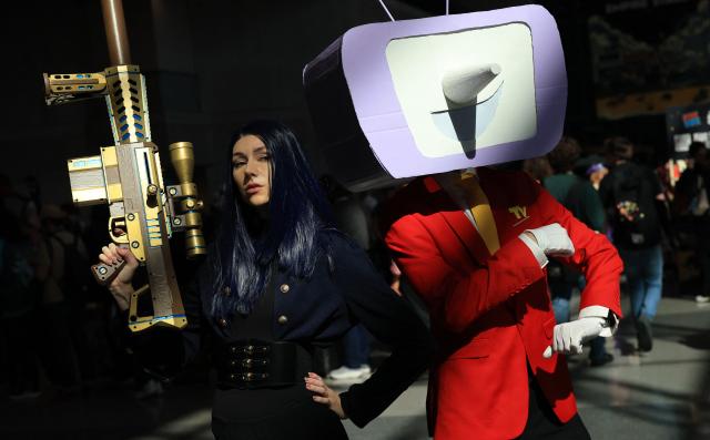 A cosplayer pose for a photograph during the New York Comic Con on its 20th anniversary at the Javits Center in New York, on October 8, 2026. The four-day event is the largest comics and pop culture event on the East Coast. (Photo by TIMOTHY A. CLARY / AFP)