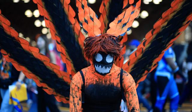 A cosplayer poses for a photograph during the New York Comic Con on its 20th anniversary at the Javits Center in New York, on October 8, 2026. The four-day event is the largest comics and pop culture event on the East Coast. (Photo by TIMOTHY A. CLARY / AFP)