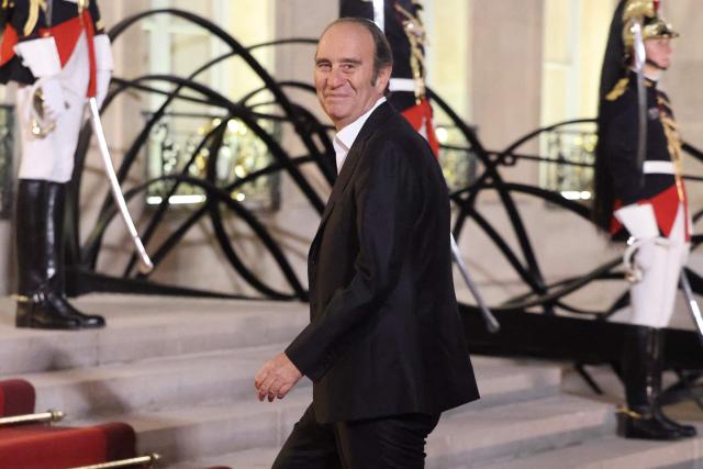 CEO of Iliad group and Free Xavier Niel arrives ahead of a state dinner hosted by France's President as part of the state visit of Germany's President, at The Elysee Presidential Palace in Paris on October 8, 2026. niel (Photo by Ludovic MARIN / AFP)