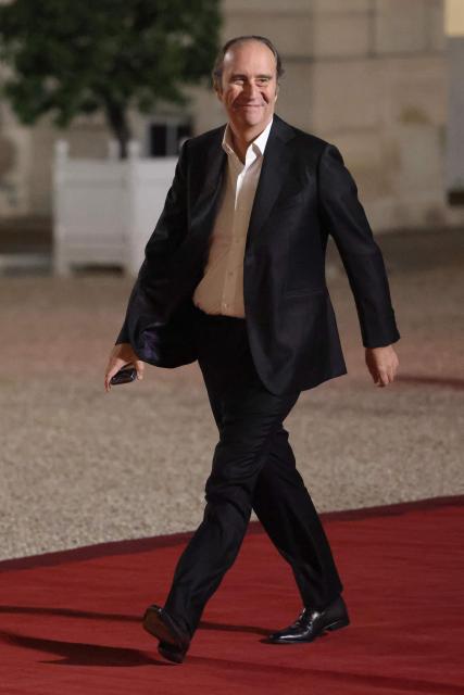 CEO of Iliad group and Free Xavier Niel arrives ahead of a state dinner hosted by France's President as part of the state visit of Germany's President, at The Elysee Presidential Palace in Paris on October 8, 2026. niel (Photo by Ludovic MARIN / AFP)