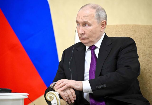 In this pool photograph distributed by the Russian state agency Sputnik, Russia's President Vladimir Putin attends a meeting with Iranian President in Turkmenbashi on October 8, 2026. (Photo by Sergei BOBYLYOV / POOL / AFP)