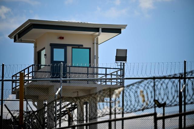A guard tower stands behind security fences topped with razor wire at the High-Security Center for Organized Crime Containment (CACCO) in Alajuela, Costa Rica, on October 8, 2026. The mega-prison, modeled after El Salvador's maximum-security CECOT, is scheduled to be inaugurated on October 14, 2026, as Costa Rica seeks to strengthen its response to organized crime. (Photo by Ezequiel BECERRA / AFP)