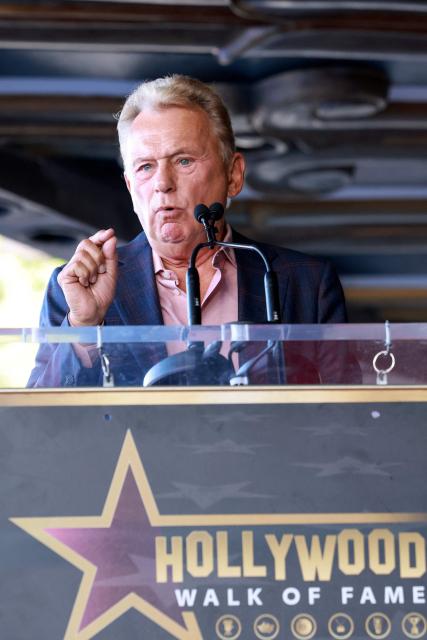 US game show host Pat Sajak speaks on stage during the Hollywood Walk Of Fame Star ceremony honoring Air Supply on October 8, 2026 in Hollywood, California. (Photo by VALERIE MACON / AFP)