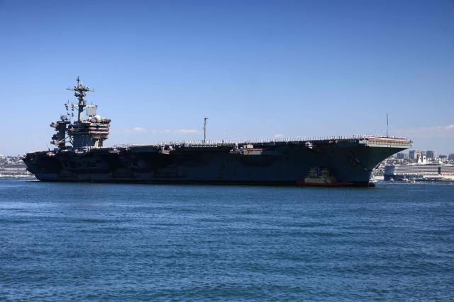 The US Navy aircraft carrier USS Abraham Lincoln (CVN-72) arrives at Naval Air Station North Island in San Diego, California, on October 8, 2026. The Nimitz-class warship returned from a lengthy, difficult Iran war deployment in which multiple service members in the carrier strike group attempted suicide. The massive nuclear-powered warship left California in November 2025 for duty in the South China Sea and was rerouted to the Middle East before US-Israeli attacks on Iran that began in late February, staying at sea until a Thailand port call in early September. (Photo by David Swanson / AFP)