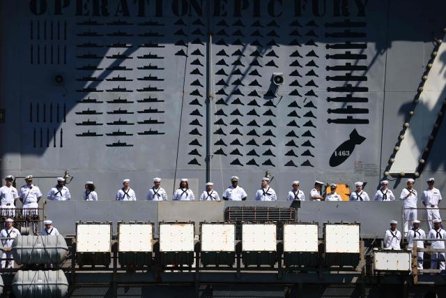 The US Navy aircraft carrier USS Abraham Lincoln (CVN-72) arrives at Naval Air Station North Island in San Diego, California, on October 8, 2026. The Nimitz-class warship returned from a lengthy, difficult Iran war deployment in which multiple service members in the carrier strike group attempted suicide. The massive nuclear-powered warship left California in November 2025 for duty in the South China Sea and was rerouted to the Middle East before US-Israeli attacks on Iran that began in late February, staying at sea until a Thailand port call in early September. (Photo by David Swanson / AFP)