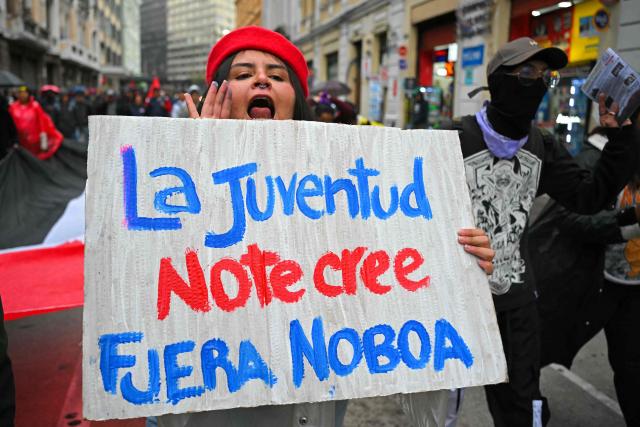 A demonstrator shouts slogans during a march organized by Ecuadorean unions and social movements against the government of President Daniel Noboa in Quito on October 8, 2026. (Photo by Rodrigo BUENDIA / AFP)