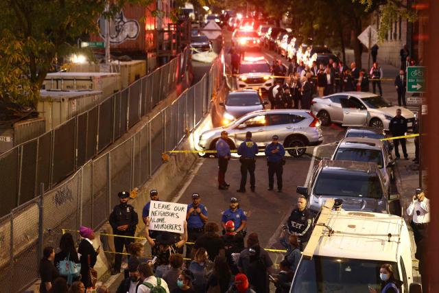 Protesters gather near the scene where a man was shot by an Immigration and Customs Enforcement (ICE) officer during an operation in the Bronx borough of New York on October 8, 2026, according to local media and police. (Photo by CHARLY TRIBALLEAU / AFP)