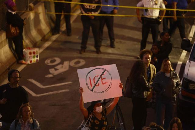 Protesters gather near the scene where a man was shot by an Immigration and Customs Enforcement (ICE) officer during an operation in the Bronx borough of New York on October 8, 2026, according to local media and police. (Photo by CHARLY TRIBALLEAU / AFP)