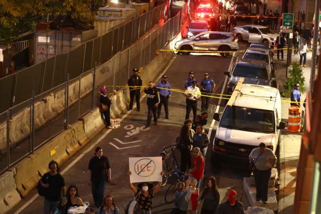 Protesters gather near the scene where a man was shot by an Immigration and Customs Enforcement (ICE) officer during an operation in the Bronx borough of New York on October 8, 2026, according to local media and police. (Photo by CHARLY TRIBALLEAU / AFP)