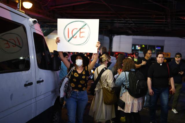Protesters near the scene where a man was shot by an Immigration and Customs Enforcement (ICE) officer during an operation in the Bronx borough of New York on October 8, 2026, according to local media and police. (Photo by CHARLY TRIBALLEAU / AFP)