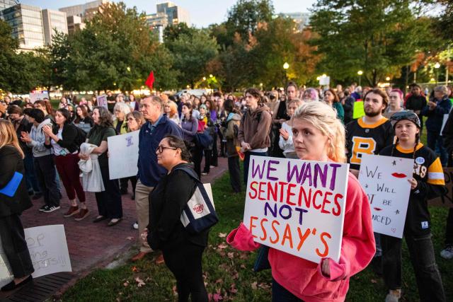 Protesters during a rally to show support for Cornell University student "Jane Doe" at Boston Common in Boston, Massachusetts on October 8, 2026. US prosecutors have reopened an investigation into an alleged 2024 gang rape at Cornell University following claims the elite university failed to properly punish the men involved. The alleged victim said in a civil lawsuit this month she was drugged with ketamine, assaulted and raped in 2024 by seven members of the Chi Phi fraternity -- a social club for male students. Cornell expelled the students involved and closed the fraternity, but the graphic details of the alleged incident have provoked public outrage and reignited a debate over sexual assault on US campuses. (Photo by JOSEPH PREZIOSO / AFP)