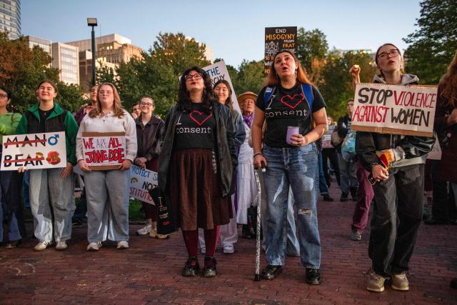 Protesters during a rally to show support for Cornell University student "Jane Doe" at Boston Common in Boston, Massachusetts on October 8, 2026. US prosecutors have reopened an investigation into an alleged 2024 gang rape at Cornell University following claims the elite university failed to properly punish the men involved. The alleged victim said in a civil lawsuit this month she was drugged with ketamine, assaulted and raped in 2024 by seven members of the Chi Phi fraternity -- a social club for male students. Cornell expelled the students involved and closed the fraternity, but the graphic details of the alleged incident have provoked public outrage and reignited a debate over sexual assault on US campuses. (Photo by JOSEPH PREZIOSO / AFP)