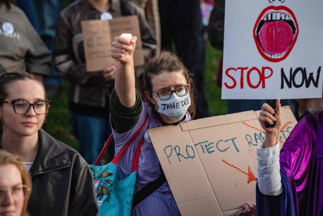 Protesters during a rally to show support for Cornell University student "Jane Doe" at Boston Common in Boston, Massachusetts on October 8, 2026. US prosecutors have reopened an investigation into an alleged 2024 gang rape at Cornell University following claims the elite university failed to properly punish the men involved. The alleged victim said in a civil lawsuit this month she was drugged with ketamine, assaulted and raped in 2024 by seven members of the Chi Phi fraternity -- a social club for male students. Cornell expelled the students involved and closed the fraternity, but the graphic details of the alleged incident have provoked public outrage and reignited a debate over sexual assault on US campuses. (Photo by JOSEPH PREZIOSO / AFP)