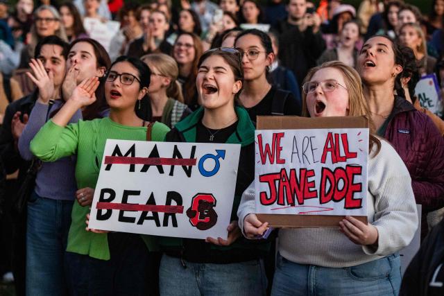 Protesters during a rally to show support for Cornell University student "Jane Doe" at Boston Common in Boston, Massachusetts on October 8, 2026. US prosecutors have reopened an investigation into an alleged 2024 gang rape at Cornell University following claims the elite university failed to properly punish the men involved. The alleged victim said in a civil lawsuit this month she was drugged with ketamine, assaulted and raped in 2024 by seven members of the Chi Phi fraternity -- a social club for male students. Cornell expelled the students involved and closed the fraternity, but the graphic details of the alleged incident have provoked public outrage and reignited a debate over sexual assault on US campuses. (Photo by JOSEPH PREZIOSO / AFP)