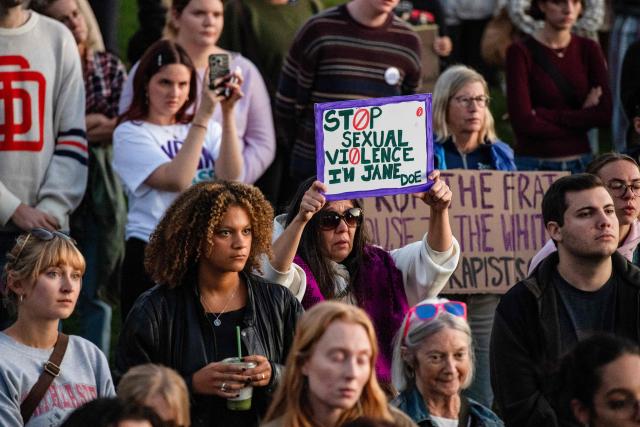 Protesters during a rally to show support for Cornell University student "Jane Doe" at Boston Common in Boston, Massachusetts on October 8, 2026. US prosecutors have reopened an investigation into an alleged 2024 gang rape at Cornell University following claims the elite university failed to properly punish the men involved. The alleged victim said in a civil lawsuit this month she was drugged with ketamine, assaulted and raped in 2024 by seven members of the Chi Phi fraternity -- a social club for male students. Cornell expelled the students involved and closed the fraternity, but the graphic details of the alleged incident have provoked public outrage and reignited a debate over sexual assault on US campuses. (Photo by JOSEPH PREZIOSO / AFP)