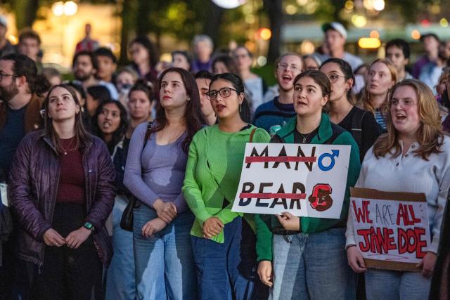Protesters during a rally to show support for Cornell University student "Jane Doe" at Boston Common in Boston, Massachusetts on October 8, 2026. US prosecutors have reopened an investigation into an alleged 2024 gang rape at Cornell University following claims the elite university failed to properly punish the men involved. The alleged victim said in a civil lawsuit this month she was drugged with ketamine, assaulted and raped in 2024 by seven members of the Chi Phi fraternity -- a social club for male students. Cornell expelled the students involved and closed the fraternity, but the graphic details of the alleged incident have provoked public outrage and reignited a debate over sexual assault on US campuses. (Photo by JOSEPH PREZIOSO / AFP)