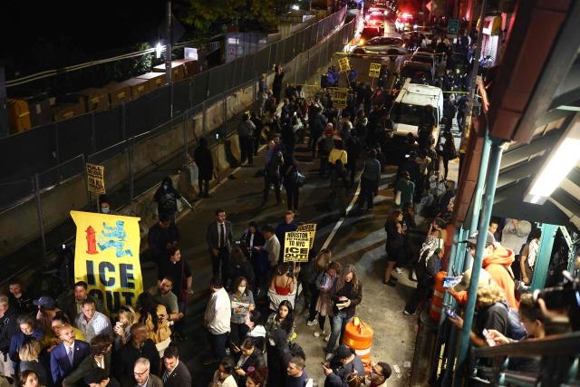 Protesters near the scene where a man was shot by an Immigration and Customs Enforcement (ICE) officer during an operation in the Bronx borough of New York on October 8, 2026, according to local media and police. (Photo by CHARLY TRIBALLEAU / AFP)