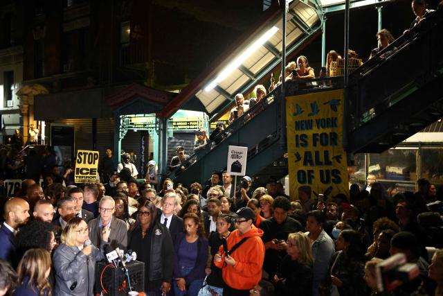 Protesters and elected officals gather near the scene where a man was shot by an Immigration and Customs Enforcement (ICE) officer during an operation in the Bronx borough of New York on October 8, 2026, according to local media and police. (Photo by CHARLY TRIBALLEAU / AFP)