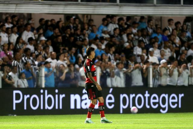 A pitchside advertisement reading “Prohibition Is Not Protection” as part of a campaign organized by the betting companies' association is seen during the Brazilian Championship Serie A football match between Santos and Flamengo at the Vila Belmiro Stadium in Santos, Brazil on October 8, 2026. (Photo by GUILHERME DIONIZIO / AFP)