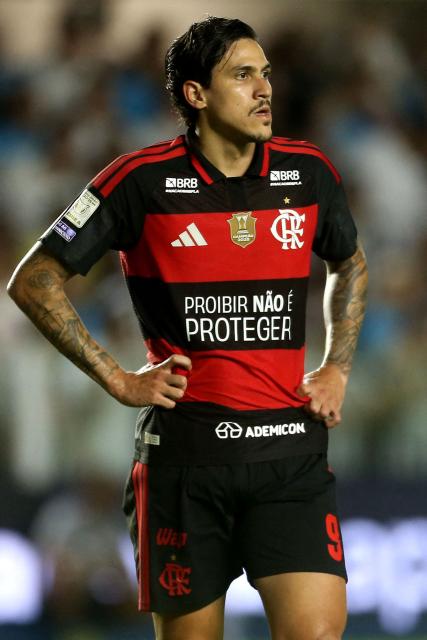Flamengo's forward #09 Pedro wears a uniform reading “Prohibition Is Not Protection” as part of a campaign organized by the betting companies' association is seen during the Brazilian Championship Serie A football match between Santos and Flamengo at the Vila Belmiro Stadium in Santos, Brazil on October 8, 2026. (Photo by GUILHERME DIONIZIO / AFP)