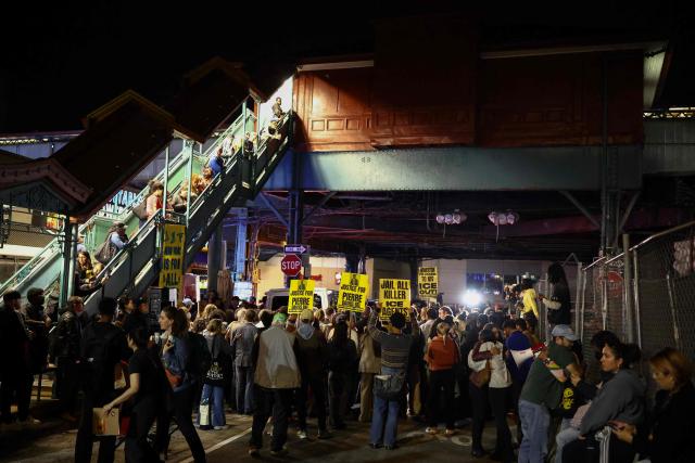 Protesters gather near the scene where a man was shot by an Immigration and Customs Enforcement (ICE) officer during an operation in the Bronx borough of New York on October 8, 2026, according to local media and police. (Photo by CHARLY TRIBALLEAU / AFP)