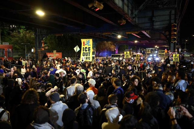Protesters gather near the scene where a man was shot by an Immigration and Customs Enforcement (ICE) officer during an operation in the Bronx borough of New York on October 8, 2026, according to local media and police. (Photo by CHARLY TRIBALLEAU / AFP)
