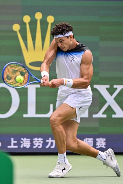 USA's Ben Shelton  hits a return to Germany's Daniel Altmaier during their men's singles match at the Shanghai Masters tennis tournament in Shanghai on October 9, 2026. (Photo by Hector RETAMAL / AFP)