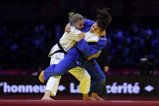 Serbia's Jovana Stjepanovic (white) competes against Australia's Maria Swan in the women's under 78 kg round of 64 at the World Judo Championships in Baku on October 9, 2026. (Photo by Anne-Christine POUJOULAT / AFP)