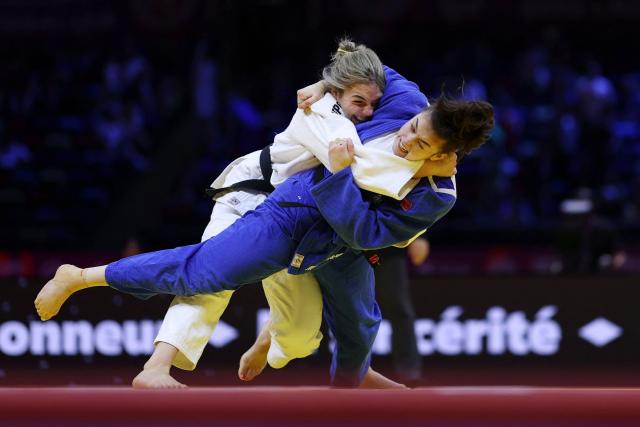 Serbia's Jovana Stjepanovic (white) competes against Australia's Maria Swan in the women's under 78 kg round of 64 at the World Judo Championships in Baku on October 9, 2026. (Photo by Anne-Christine POUJOULAT / AFP)