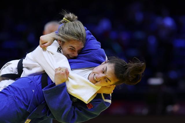 Serbia's Jovana Stjepanovic (white) competes against Australia's Maria Swan in the women's under 78 kg round of 64 at the World Judo Championships in Baku on October 9, 2026. (Photo by Anne-Christine POUJOULAT / AFP)