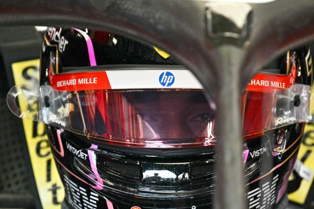 Ferrari's Monegasque driver Charles Leclerc sits in his car in the pits during a practice session ahead of the Formula One Singapore Grand Prix at the Marina Bay Street Circuit in Singapore on October 9, 2026. (Photo by ANTHONY WALLACE / AFP)