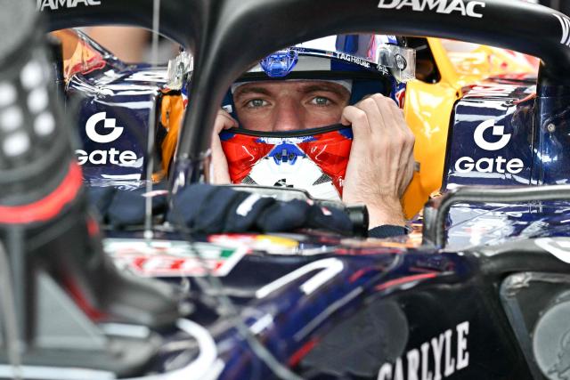 Red Bull Racing's Dutch driver Max Verstappen sits in his car in the pits during a practice session ahead of the Formula One Singapore Grand Prix at the Marina Bay Street Circuit in Singapore on October 9, 2026. (Photo by ANTHONY WALLACE / AFP)